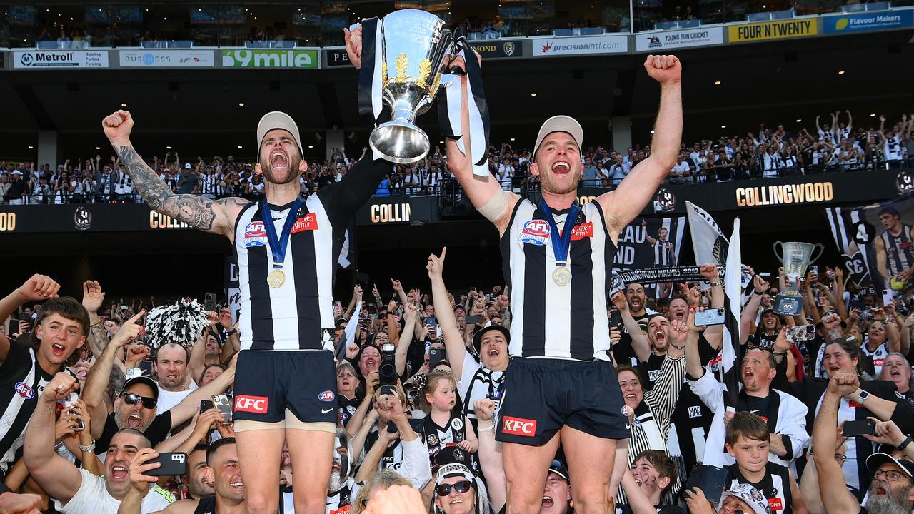 Jeremy Howe and Tom Mitchell get their moment with the cup. Picture: Quinn Rooney/Getty Images