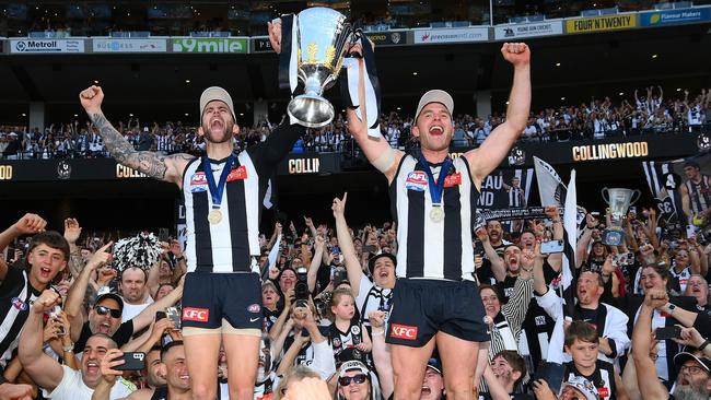 Jeremy Howe and Tom Mitchell get their moment with the cup. Picture: Quinn Rooney/Getty Images