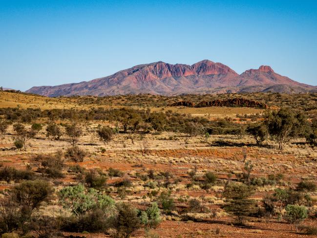 Red centre landscape with distant view of Mount Sonder in NT outback AustraliaPhoto - istockTake a Hike