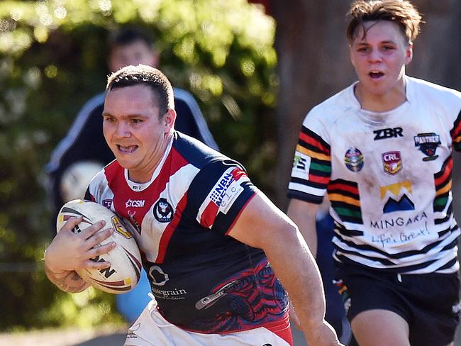 Caine Wynyard goes over to score a try for Erina yesterday. Picture: Troy Snook