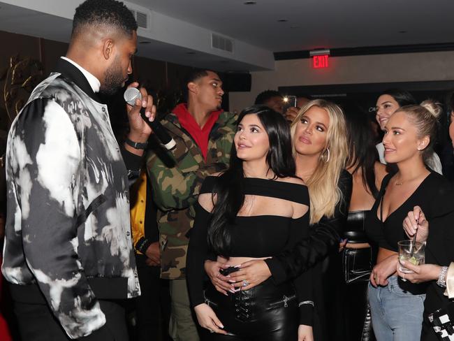 Kylie Jenner and Khloe Kardashian, centre, shared a tender moment at Tristian’s birthday bash. Picture: Getty Images