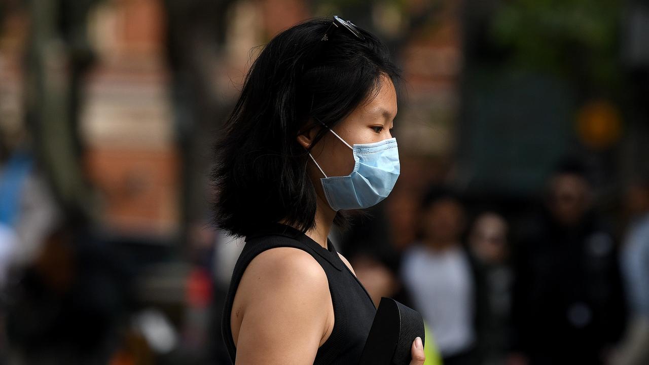 A woman wearing a face mask is seen in Sydney. Picture: NCA NewsWire/Bianca De Marchi