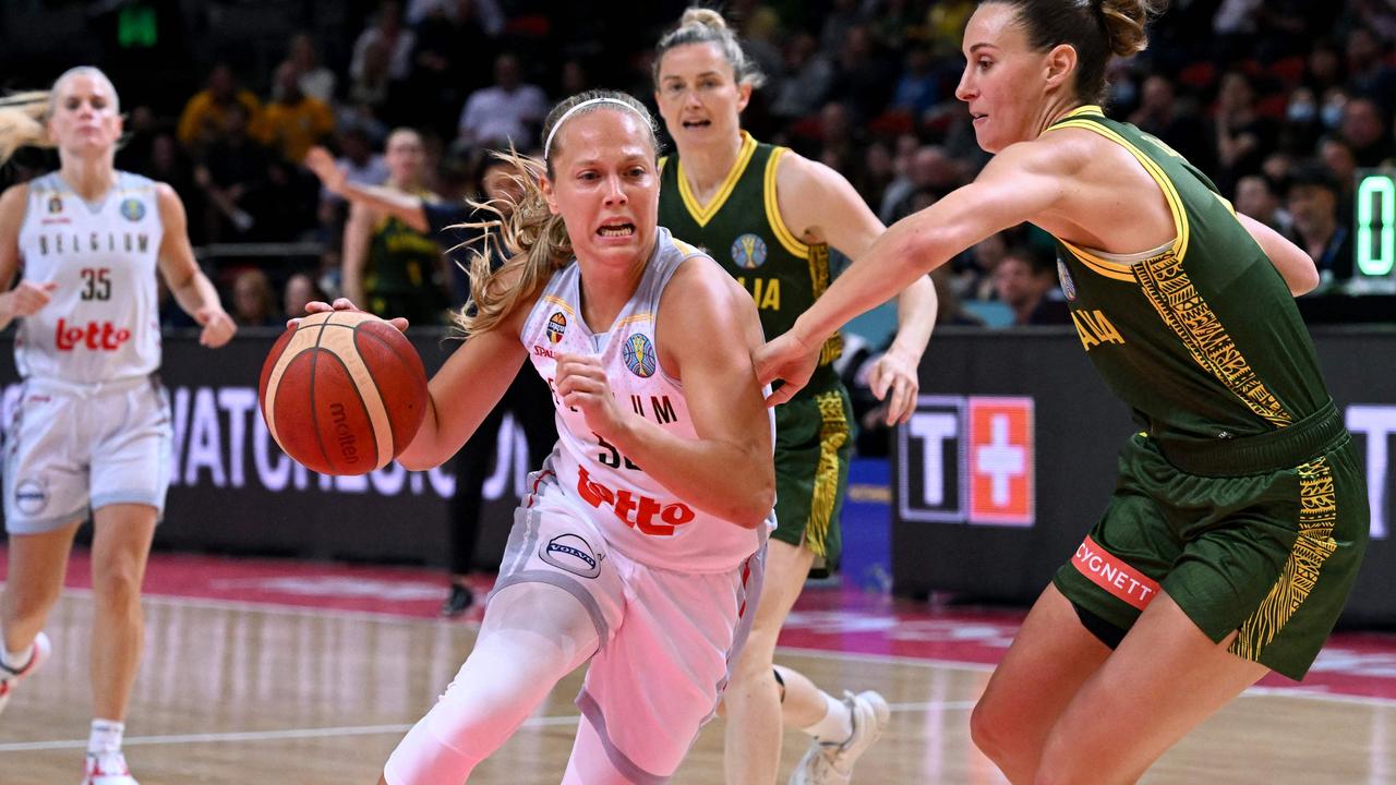 Belgium's Julie Allemand (C) is checked by Australia's Steph Talbot (R).