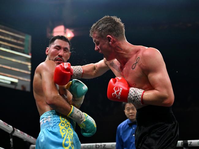 Andrei Mikhailovich lands a punch as he defended his IBF title. Picture: No Limit Boxing