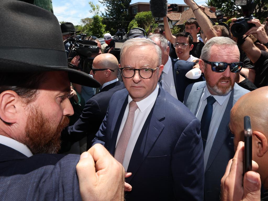 Anthony Albanese is surrounded at Adass Israel Synagogue on Tuesday. Picture: David Caird