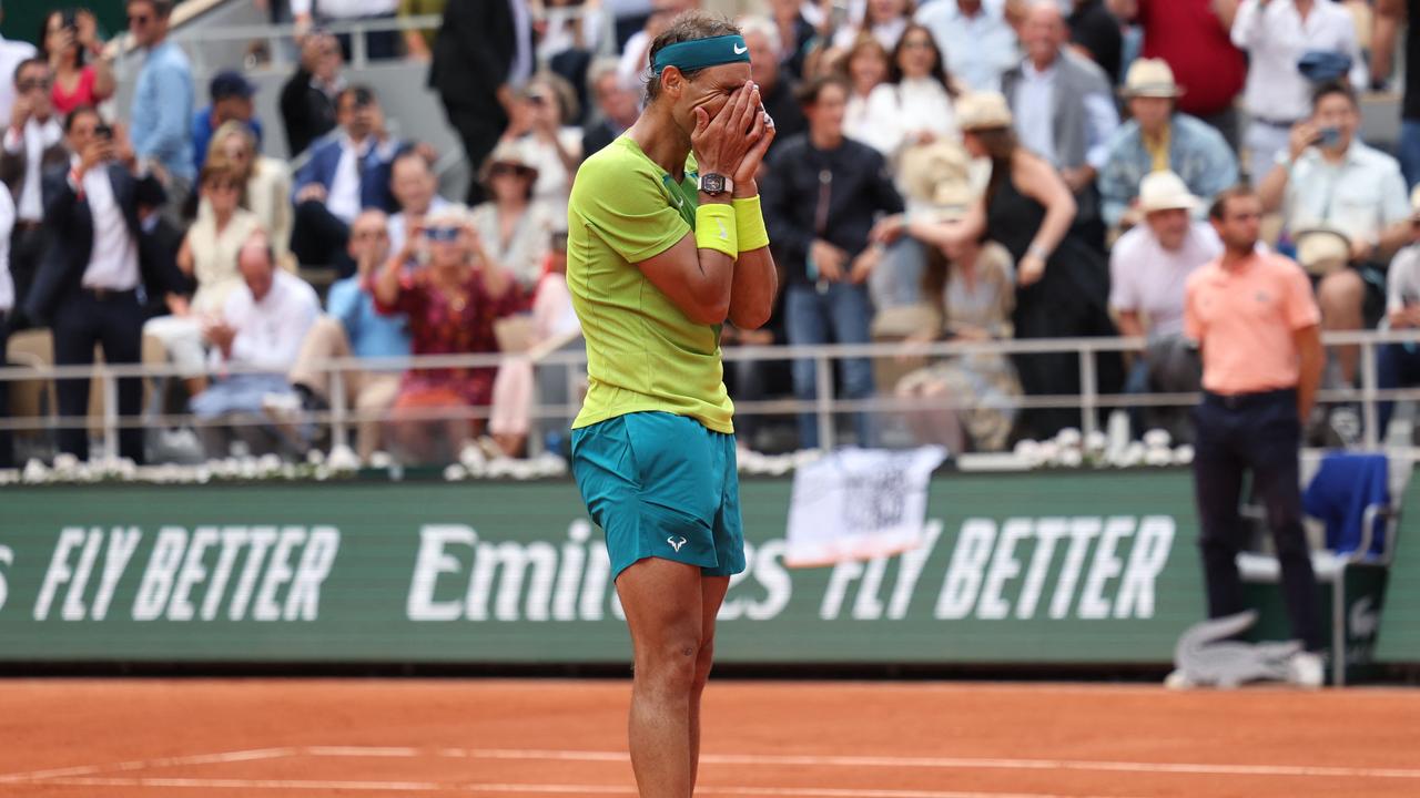 Spain's Rafael Nadal celebrates after winning against Norway's Casper Ruud at the end of their men's singles final match on day fifteen of the Roland-Garros Open tennis tournament at the Court Philippe-Chatrier in Paris on June 5, 2022. (Photo by Thomas SAMSON / AFP)