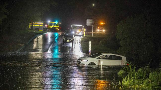 A vehicle stranded in water at Hardys Rd in Bonogin. Picture: Jerad Williams