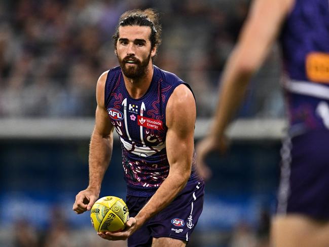 PERTH, AUSTRALIA - MAY 24: Alex Pearce of the Dockers handpasses the ball during the 2024 AFL Round 11 match between Walyalup (Fremantle) and the Collingwood Magpies at Optus Stadium on May 24, 2024 in Perth, Australia. (Photo by Daniel Carson/AFL Photos via Getty Images)