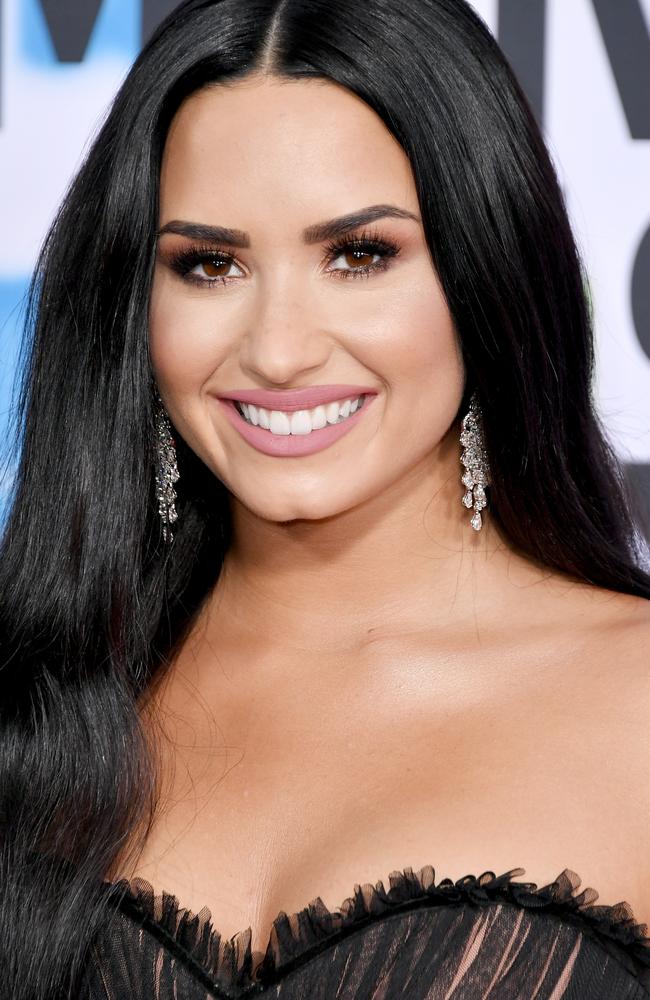 She teamed the goth dress with Kardashian-style makeup.