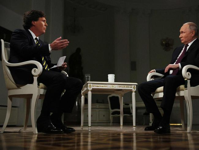 In this pool photograph distributed by Russian state agency Sputnik, Russia's President Vladimir Putin gives an interview to US talk show host Tucker Carlson at the Kremlin in Moscow on February 6, 2024. (Photo by Gavriil GRIGOROV / POOL / AFP)