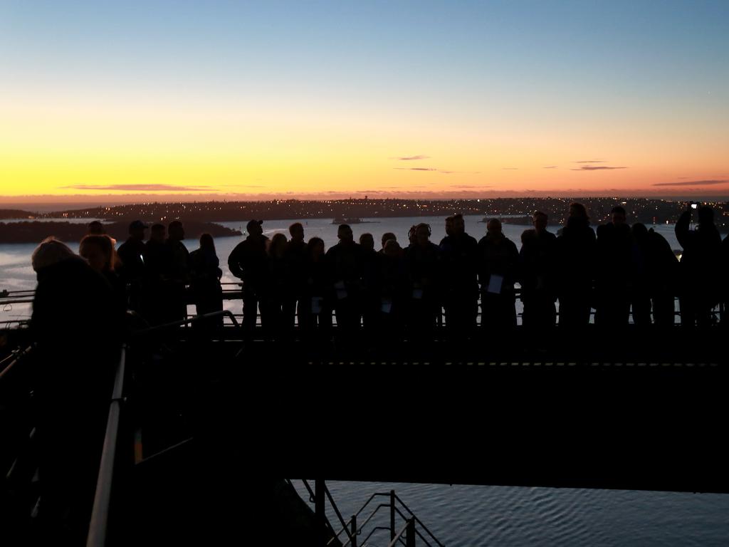 A dawn service was held on the summit of the Sydney Harbour Bridge to commemorate ANZAC Day. Money raised by the members of the public who climbed the bridge went to RSL DefenceCare. Picture: Toby Zerna