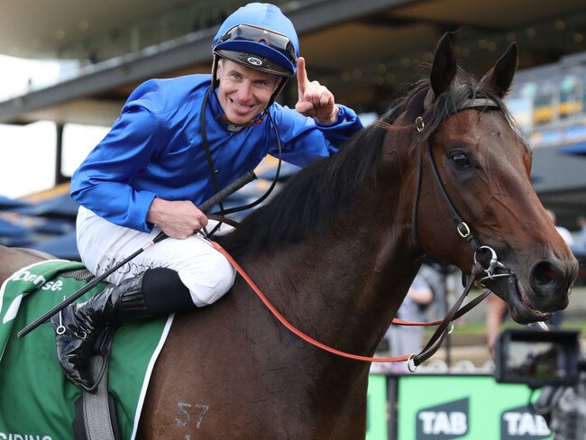 James McDonald celebrates winning  his third Golden Rose aboard Broadsiding at Rosehill on Saturday. Photo: Jeremy Ng/Getty Images.