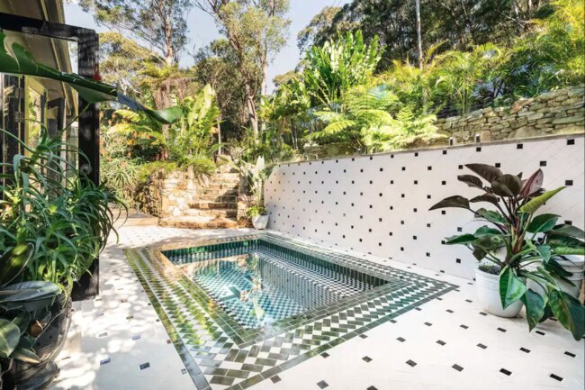 The outdoor pool is set in a rainforestesque environment. Picture: Airbnb