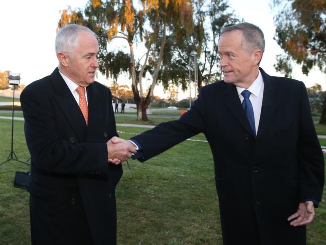 Malcolm Turnbull and Opposition Leader Bill Shorten shake hands as they wait to appear on morning TV out the front of Parliament House, Canberra. Picture: Kym Smith