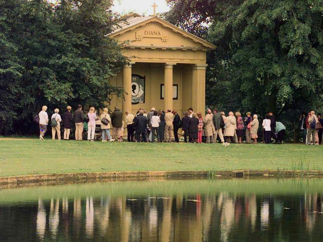 Visitors looking at Diana’s memorial on the Althorp estate in 1999.