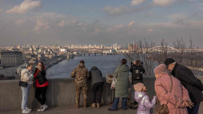 People visit an area overlooking the Dnipro River and the city skyline in downtown Kyiv during the week. Picture: AFP)