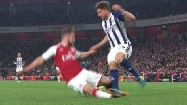 Mustafi takes out Jay Rodriguez.