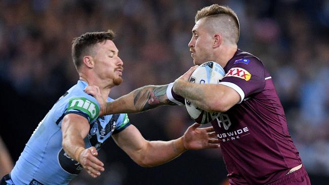 Cameron Munster fends off Damien Cook. Picture: Picture: AAP