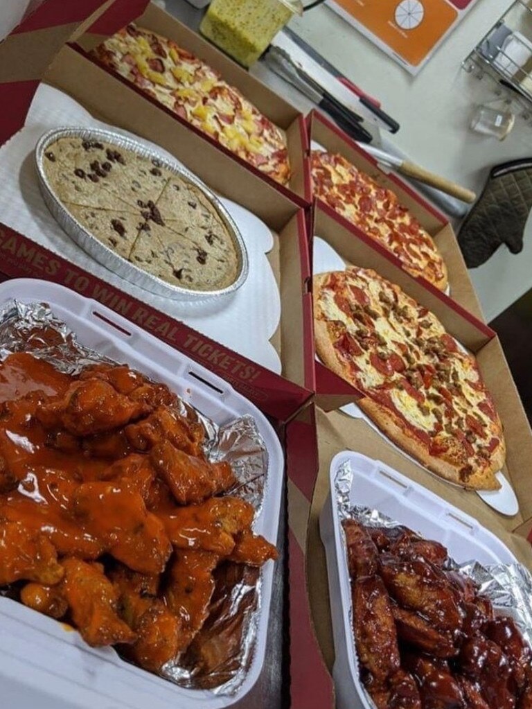 The US menu features pizza, wings, cakes and giant cookies. Picture: Facebook.