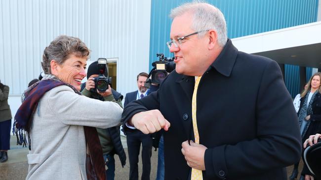 Prime Minister Scott Morrison practices social distance greeting with Liberal candidate for Eden-Monaro Fiona Kotvojs in Canberra today. Picture: Adam Taylor/PMO