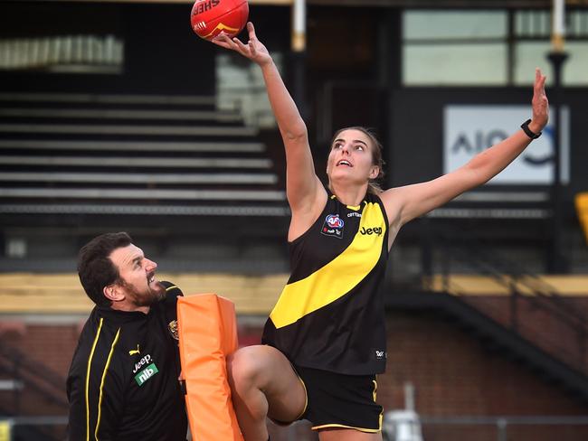 Richmond CEO Brendon Gale is acting as a ruck coach for the club's AFLW side. Brendon Gale with the club's newest recruit, Alice Edmonds. Picture: Tony Gough