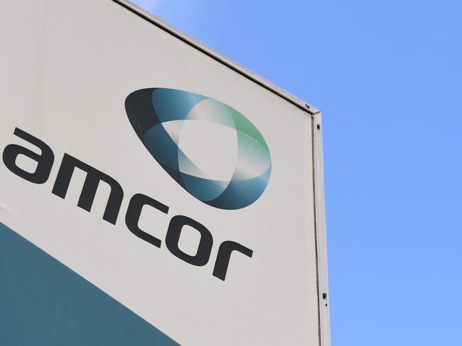 A sign of Australian packaging group Amcor is seen outside one of its packaging facilities in Melbourne on August 7, 2018. Australian firm Amcor announced a 6.8 billion USD buyout of US rival Bemis on August 7 to become the world's largest plastic packaging group, and will shift its primary listing to the New York Stock Exchange. / AFP PHOTO / William WEST