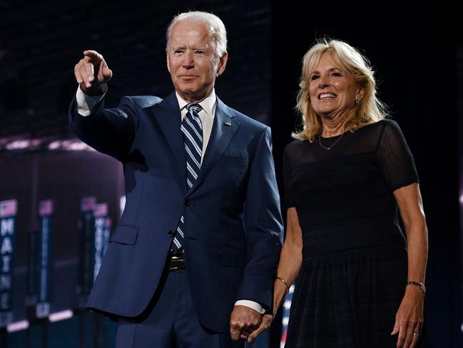 Former vice-president and Democratic presidential nominee Joe Biden and his wife Former Second Lady of the United States doctor Jill Biden stand on stage at the end of the third day of the Democratic National Convention, being held virtually amid the novel coronavirus pandemic, at the Chase Center in Wilmington, Delaware on August 19, 2020. (Photo by Olivier DOULIERY / AFP)