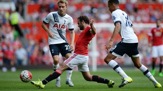 Manchester United's Spanish midfielder Juan Mata (2nd L) vies with Tottenham Hotspur's Danish midfielder Christian Eriksen and Tottenham Hotspur's English midfielder Dele Alli.