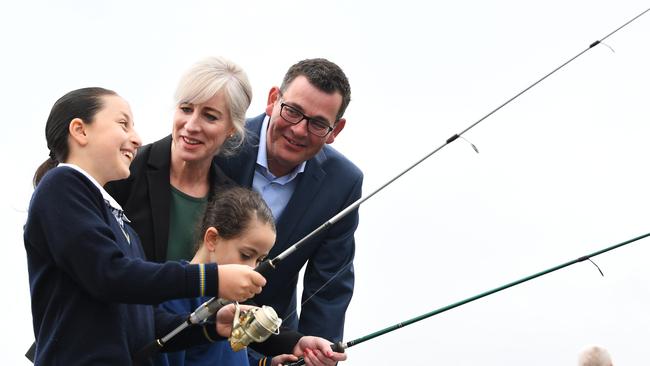 Daniel Andrews and his wife Catherine at the Mordialloc Pier in 2018. The Premier announced that a re-elected Andrews Government would improve boating and fishing regulations and licensing across Victoria. Picture: AAP Image/James Ross