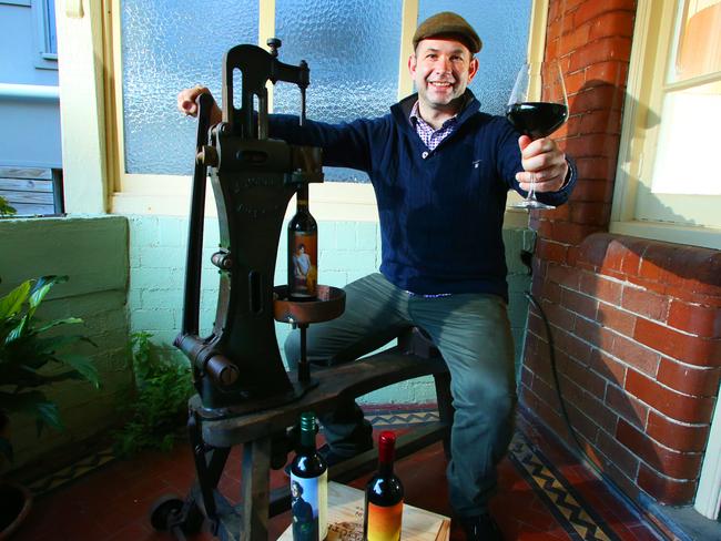 At home with his old-fashioned corking machine. Picture: Phillip Rogers