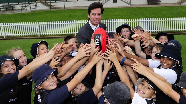 AFL boss Gillon McLachlan gets swamped at Unley Primary. Picture: Mark Brake