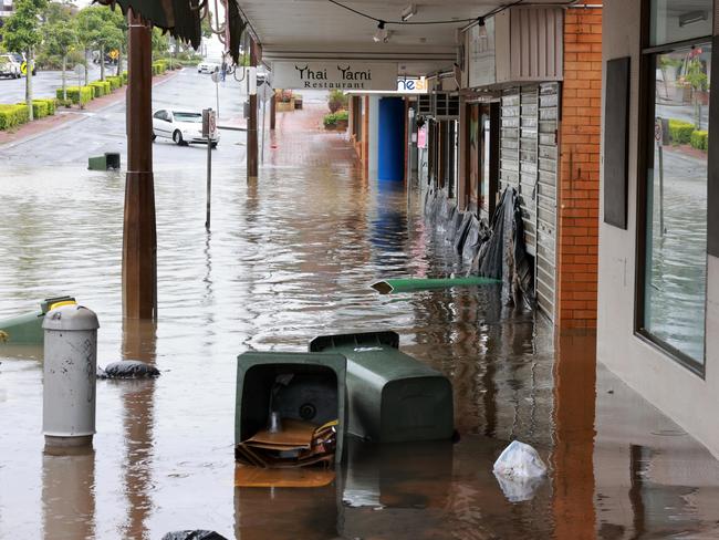 Floodwaters are seen in and around Taree on the mid-north coast of NSW as torrential rain inundates the region, cutting off communities with NSW SES crews winching people to safety from rooftops and surging rivers. Picture: NewsWire / Scott Calvin