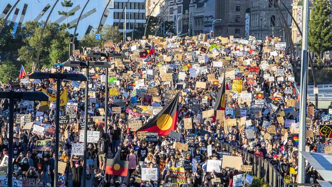 Black Lives Matter protesters march across Victoria Bridge. Picture: Richard Walker