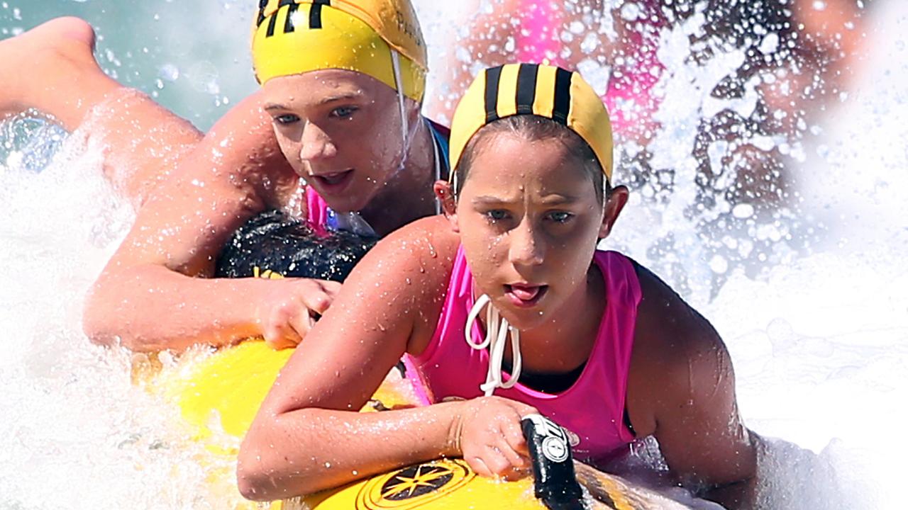 Ava Halliday (front) and Eliza Parish in Nippers State Championships Under 12 board rescue finals. Picture: Richard Gosling.