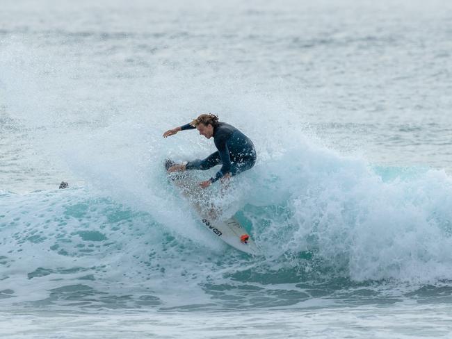 Fremantle champion Fyfe rides a wave while in south-east Queensland.