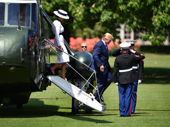 US President Donald Trump and Melania Trump disembark Marine One at Buckingham Palace ahead of the ceremonial welcome. Picture: Getty Images