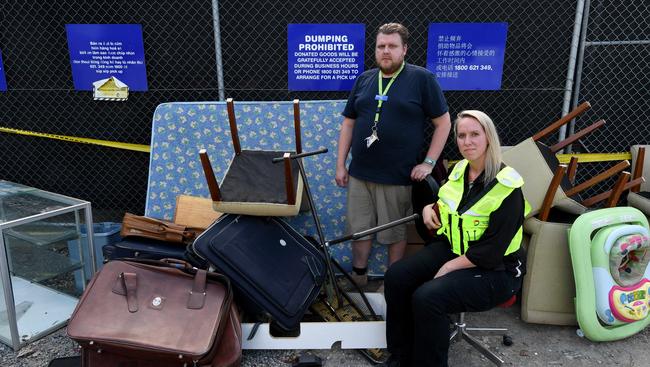 Vinnies Springvale shop manager Gavin Paulokat and Dandenong Council local law officer Mel White with illegally dumped goods and rubbish at the back of the shop. Picture: Penny Stephens