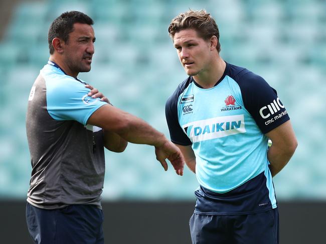 Waratahs coach Daryl Gibson talks to captain Michael Hooper. Picture: Getty