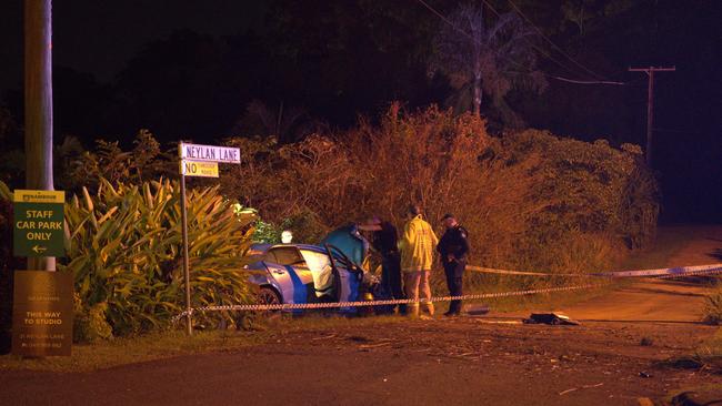 Police inspect the scene where a blue Toyota Corolla crashed into a white Suzuki Swift in Woombye.