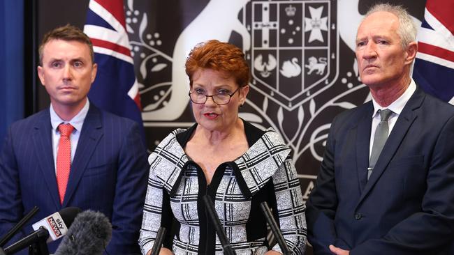 Queensland Senator and One Nation leader Pauline Hanson, centre, flanked by party officials James Ashby and Steve Dickson. Picture: AAP