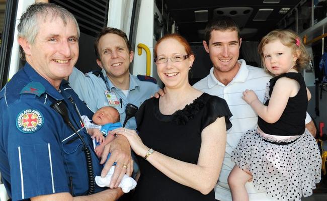 Ambulance delivery - Advance Care Paramedics Kevin Brand and Simon Knight reunite with the baby they delivered in the back of their ambulance. Baby Logan, Lucinda, Robin and Calista Van Bael of Mungar. Picture: Valerie Horton