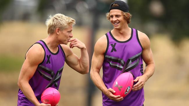 Isaac Heeney and Nat Fyfe share a laugh during AFLX training.