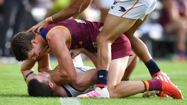 Lion Jarrod Berry and Brad Crouch get up close and personal in Round 9. Picture: AAP Image/Darren England