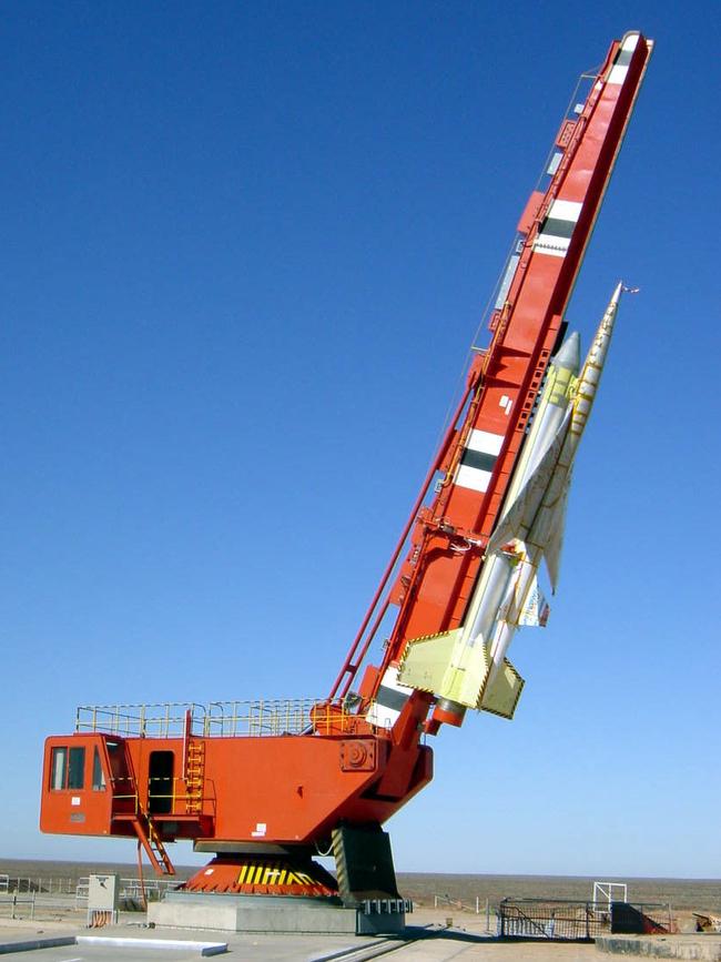  D/I Scale model supersonic passenger aircraft prototype (NEXST) attacked to rocket on launch pad at Woomera rocket range, 2002.