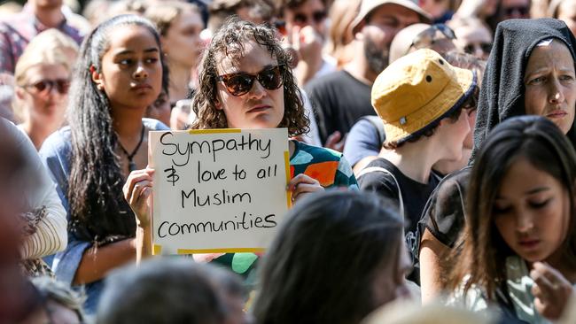 A supporter holds a sign reading “Sympathy &amp; love to all Muslim communities”. Picture: Tim Carrafa