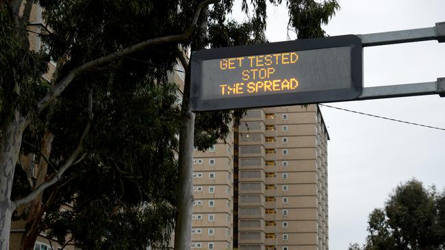 A public health notice near the Flemington public housing estate encouraging people to test for COVID-19. Picture: NCA NewsWire / Andrew Henshaw