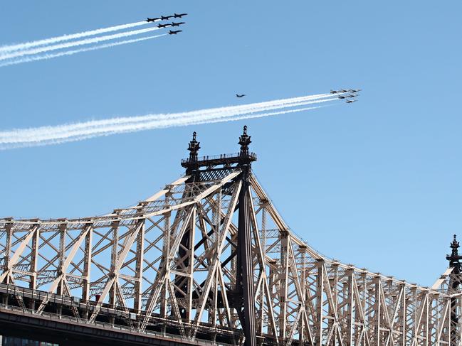 Military aircraft fly over the Queensboro Bridge in New York City. Picture: Getty Images/AFP