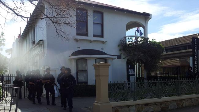 STAR group officers searching for Rodney Clavell around Pulteney Grammar School . Photo: Greg Higgs