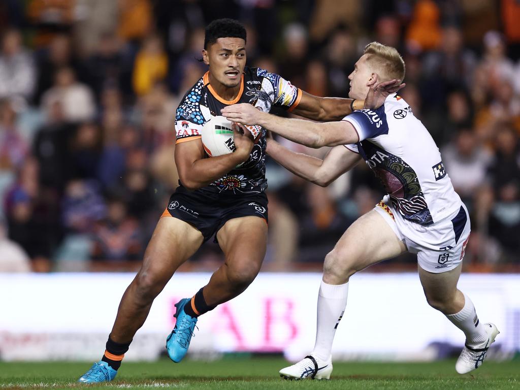 Junior Tupou fends off Tom Dearden. Picture: Getty Images