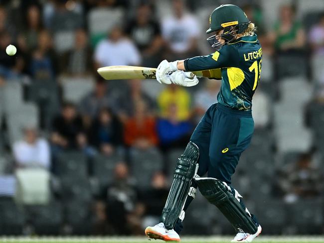 Phoebe Litchfield bludgeons her way to an unbeaten half-century for Australia during game one of the Women's T20 International Series between Australia and New Zealand. (Photo by Albert Perez/Getty Images)